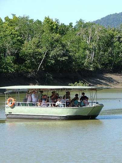Whitsunday Crocodile Safari boat with guests cruising the Proserpine River past the mangroves