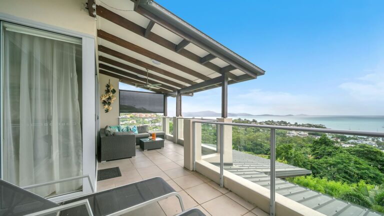 Balcony outdoor lounge looking over the Coral Sea, 1 bedroom apartment at Whitsunday Reflections