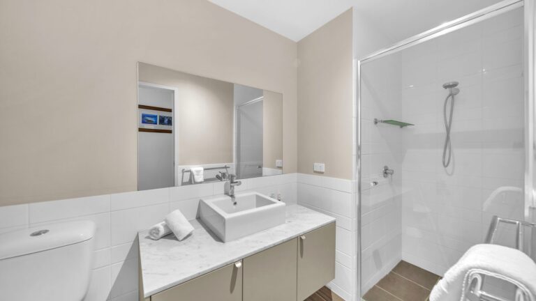 Ensuite with shower, marble-topped vanity and wide mirror, 3 bedroom apartment at Whitsunday Reflections, Airlie Beach