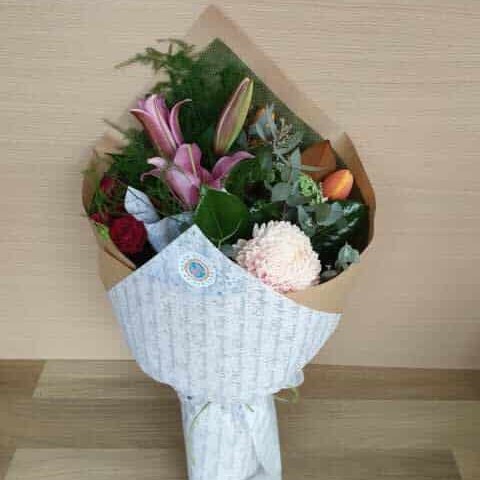 Wrapped mixed bouquet of lilies, chrysanthemum, roses and native foliage, flowers delivered to Whitsunday Reflections, Airlie Beach