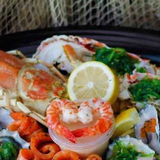 Honeymoon seafood platter with crab, peeled prawns, twirls of smoked salmon and dressed oysters, delivered to Whitsunday Reflections, Airlie Beach