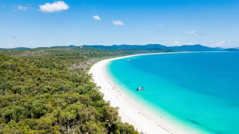 Aerial view of Whitehaven Beach curving along Whitsunday Island