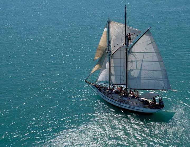 Providence V, a gaff-rigged schooner run by Whitsunday Sailing, under sail on open water in the Whitsundays
